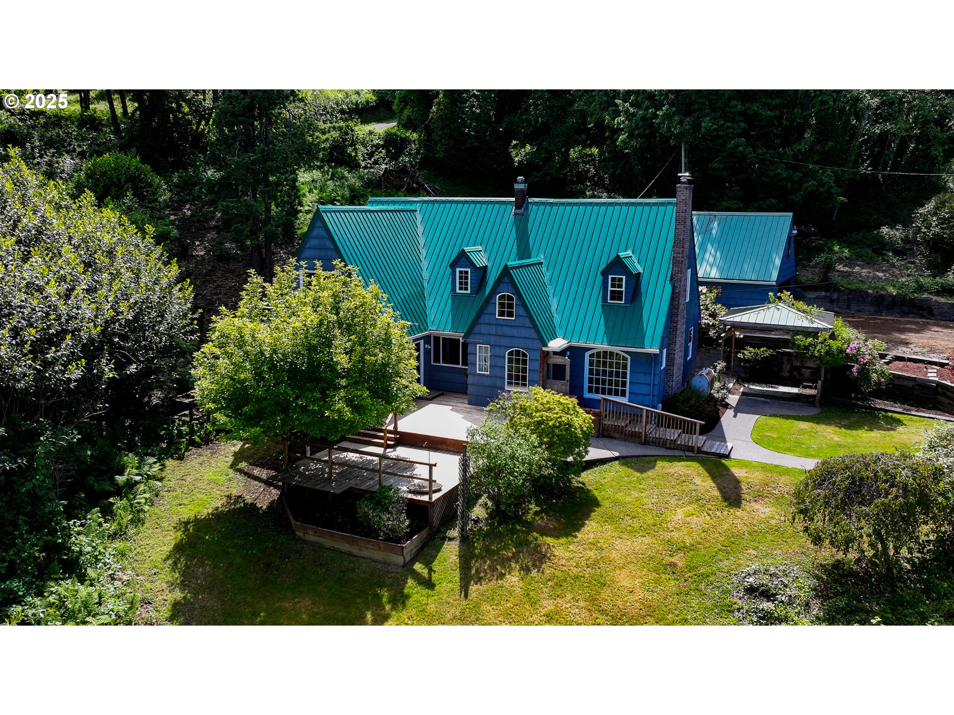 13005 I Street Nehalem, OR 97131 - Photo 38 of 45 a swimming pool view with a garden