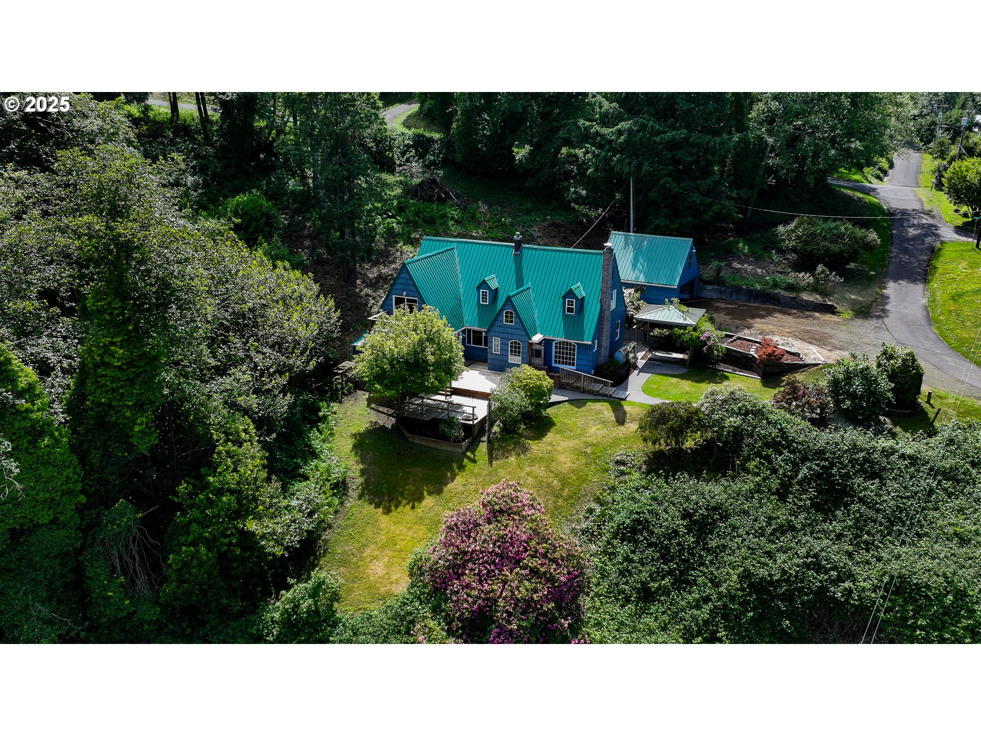 13005 I Street Nehalem, OR 97131 - Photo 44 of 45 a view of a house with a garden and lake view