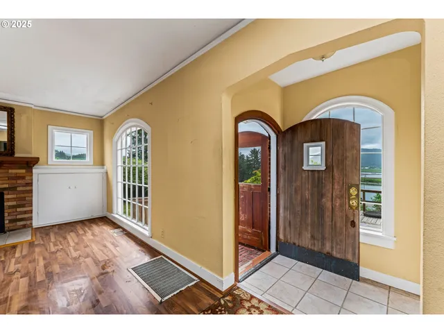a view of front door with wooden floor