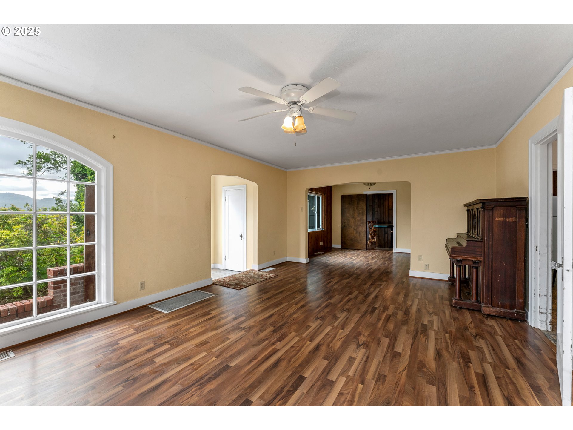 13005 I Street Nehalem, OR 97131 - Photo 7 of 45 a view of an empty room with wooden floor and a window