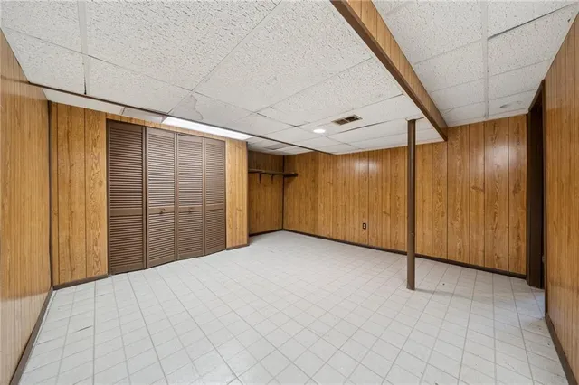 a view of patio with table and chairs and potted plants
