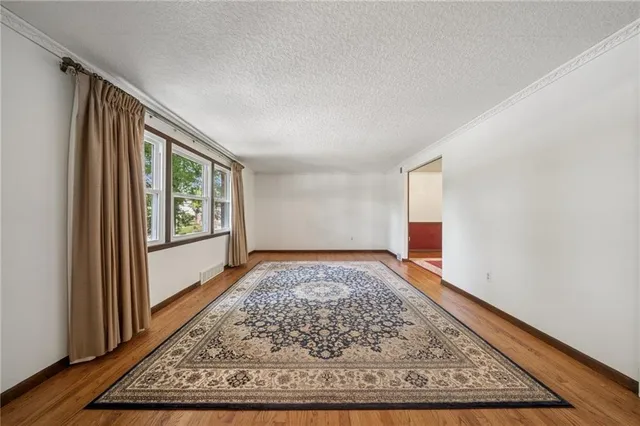 a view of an empty room and window