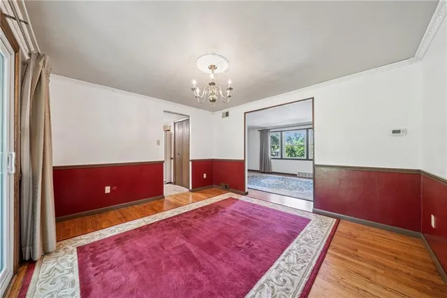 a kitchen with a refrigerator a stove cabinets and a counter top space