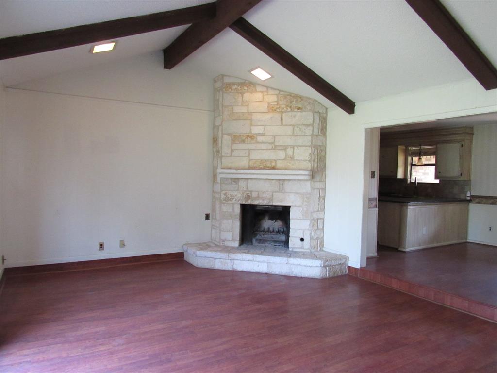 2008 Dan Rowe Street Waco, TX 76704 - Photo 3 of 13 an empty room with windows and fireplace