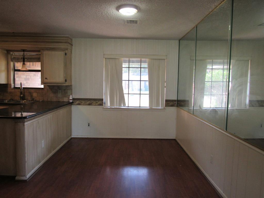2008 Dan Rowe Street Waco, TX 76704 - Photo 5 of 13 a view of a kitchen with wooden floor and a window