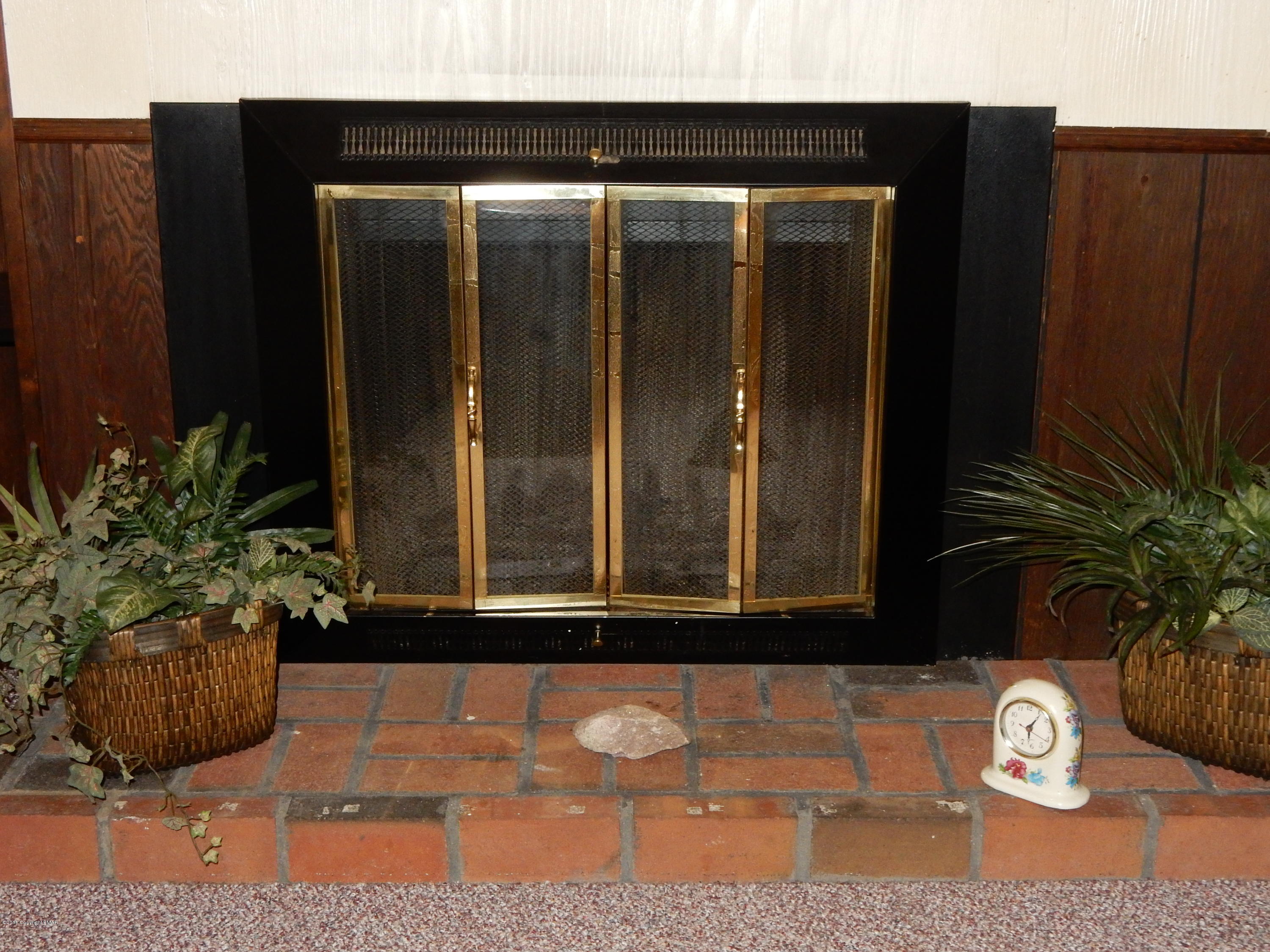 183 Fish Hill Road Tannersville, PA 18372 - Photo 17 of 33 Living room fireplace