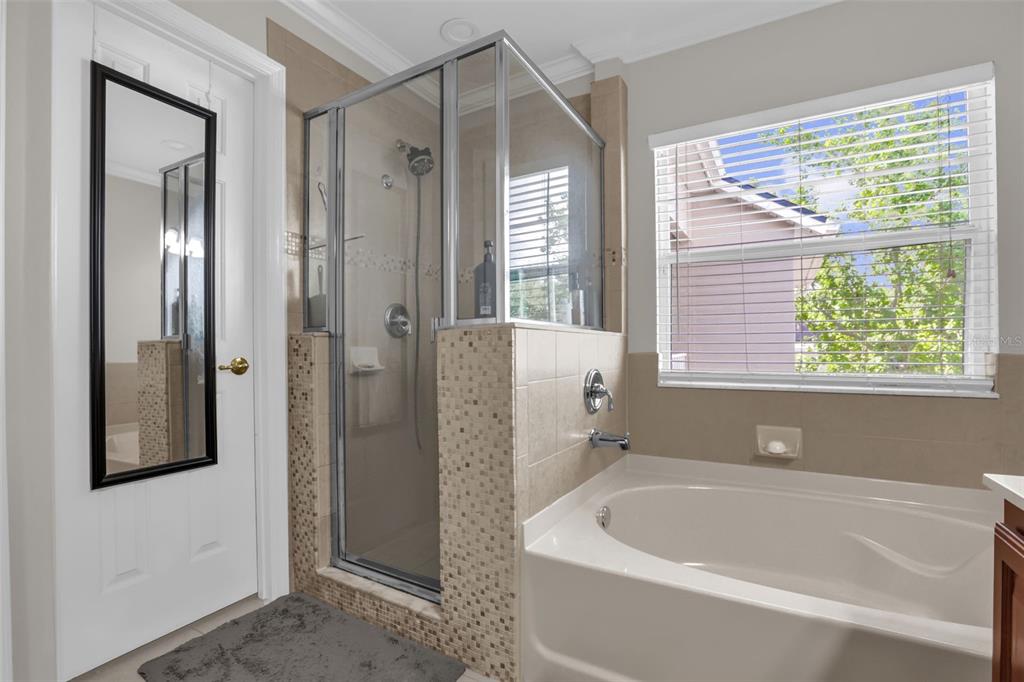 2165 Ridgewood Street Orlando, FL 32803 - Photo 20 of 37 a bathroom with a bathtub and a shower