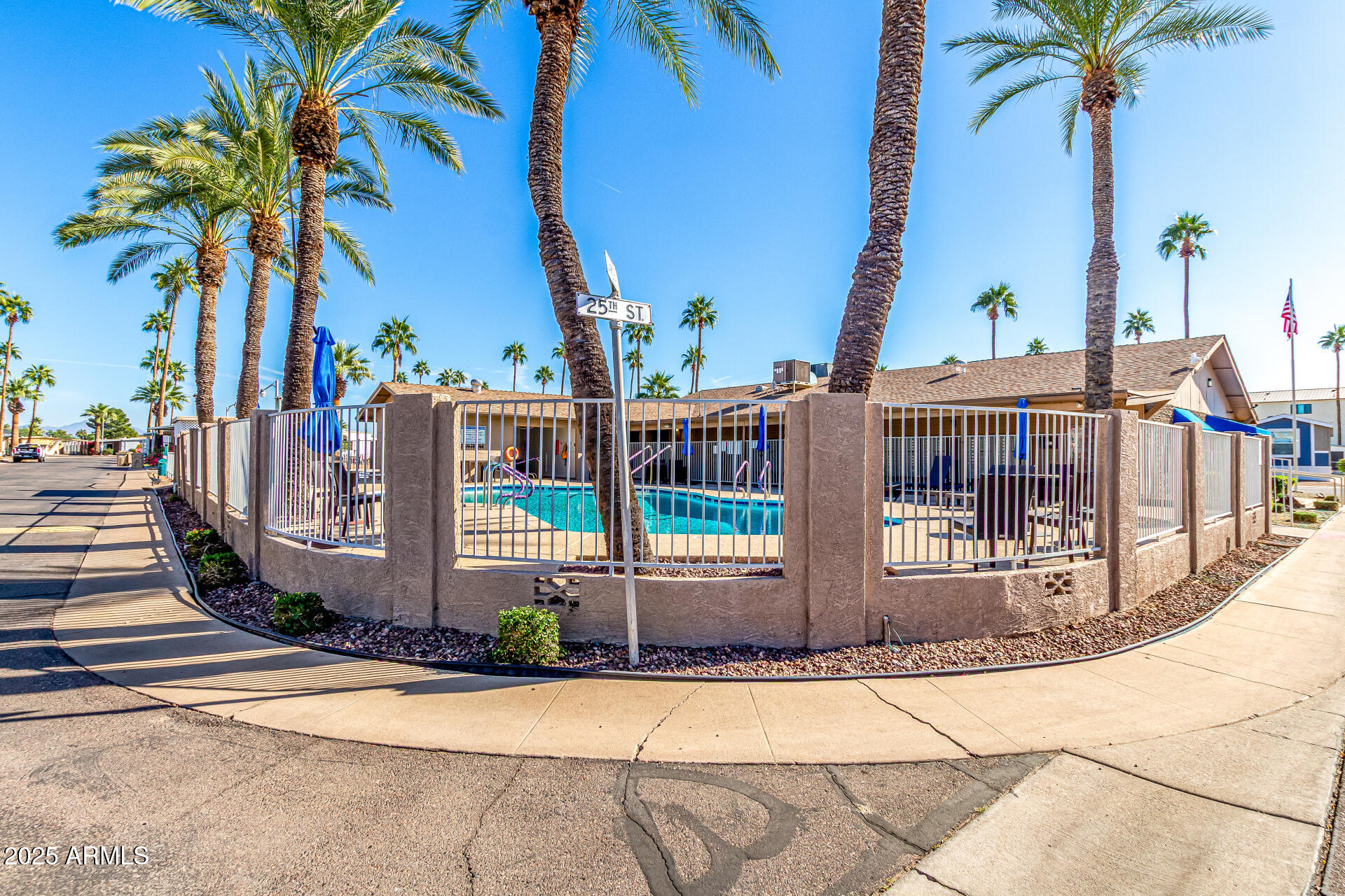 16225 North Cave Creek Road, Unit 79 Phoenix, AZ 85032 - Photo 30 of 32 a view of a house with a yard and palm trees