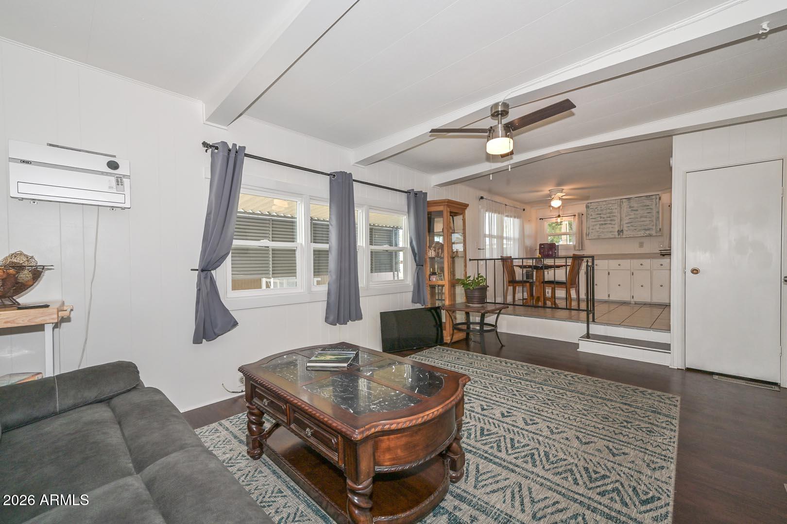 16225 North Cave Creek Road, Unit 79 Phoenix, AZ 85032 - Photo 5 of 32 a living room with furniture and a table