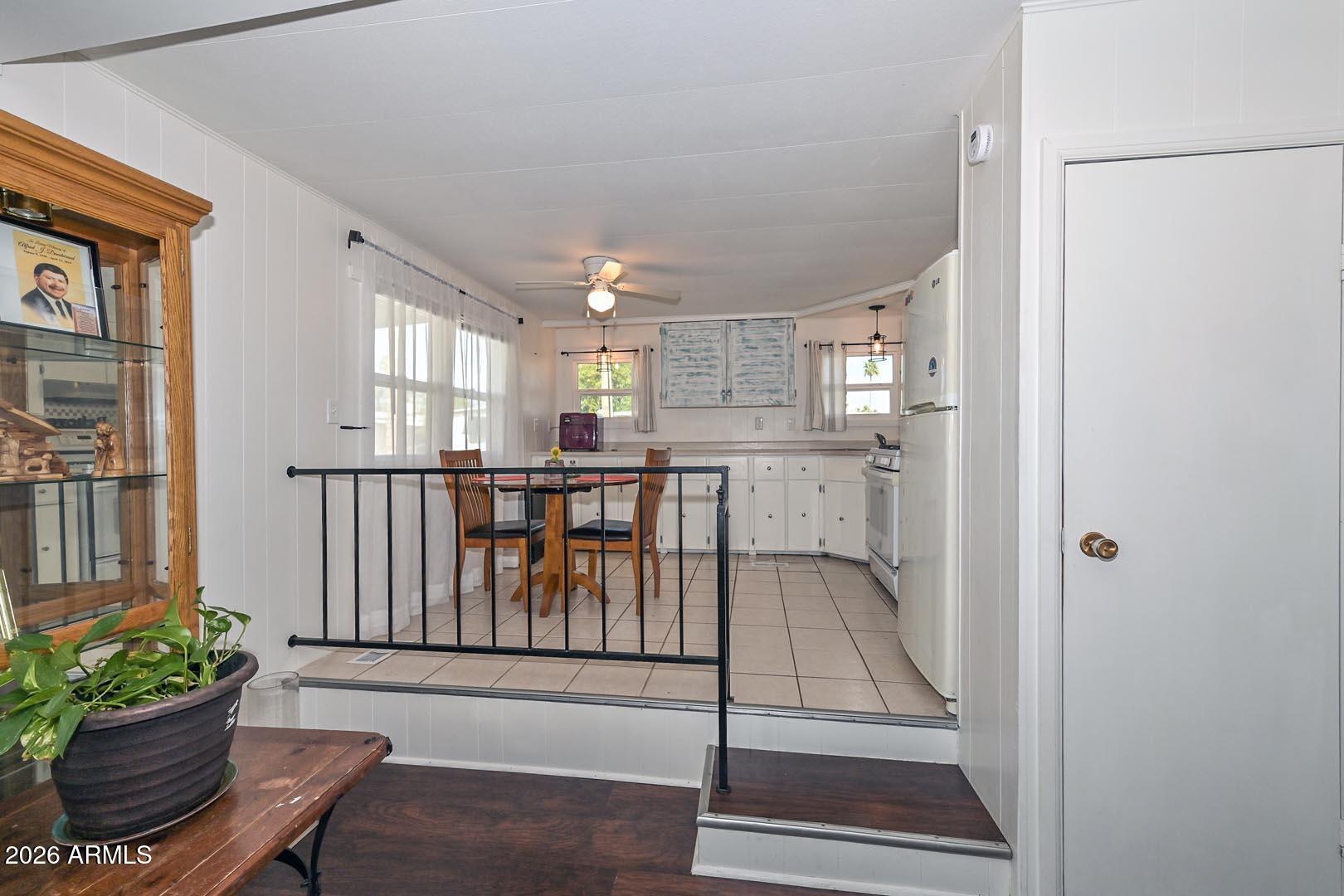 16225 North Cave Creek Road, Unit 79 Phoenix, AZ 85032 - Photo 8 of 32 a view of entryway and kitchen