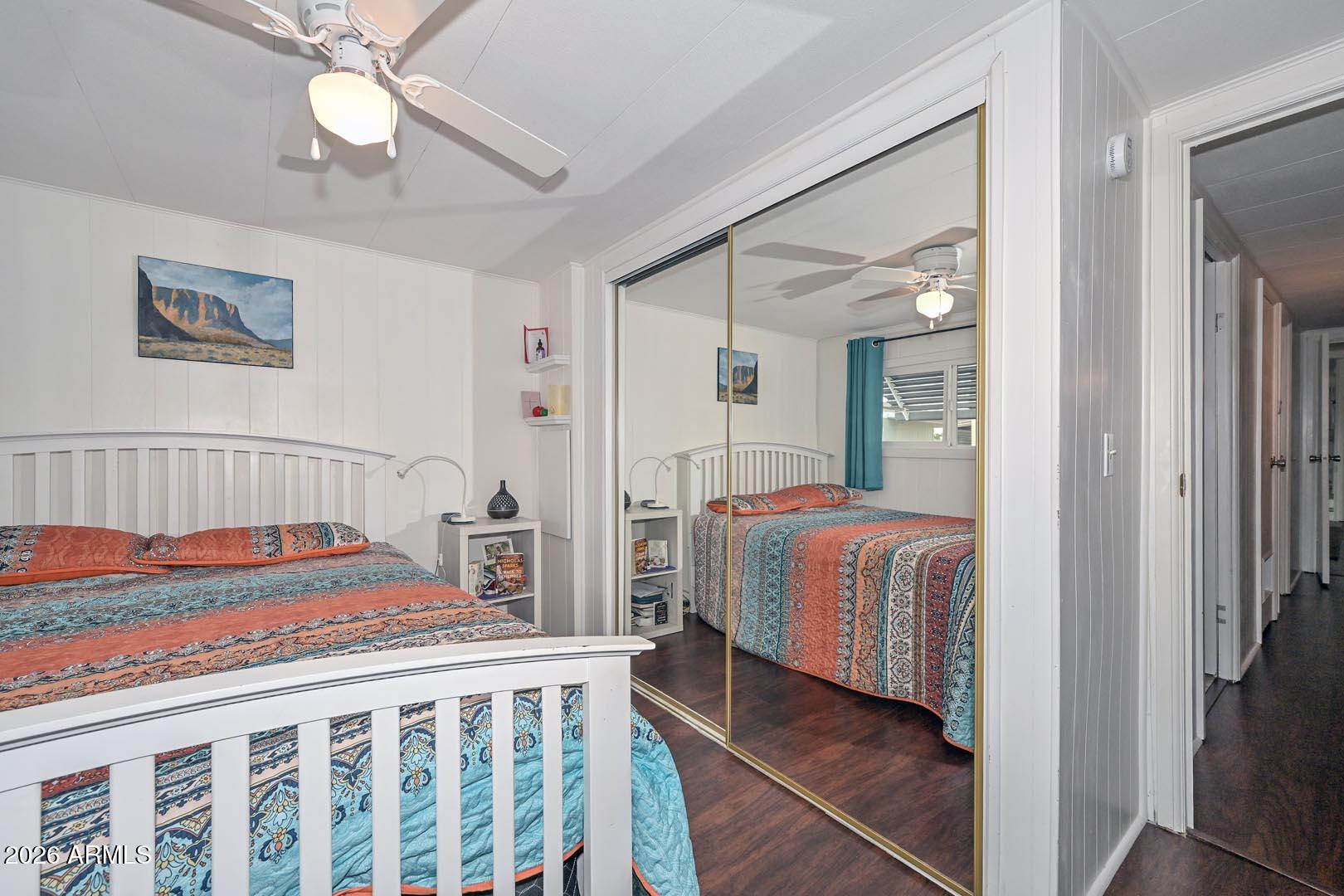 16225 North Cave Creek Road, Unit 79 Phoenix, AZ 85032 - Photo 10 of 32 a bedroom with a bed and a chandelier