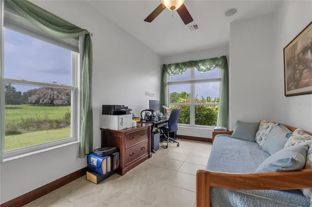a dining room with furniture and a window