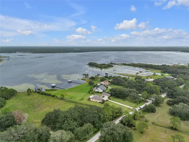 a large kitchen with kitchen island a large island in the center