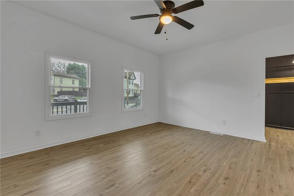 193 Virginia Avenue Rochester, PA 15074 - Photo 6 of 37 a view of empty room with wooden floor and fan