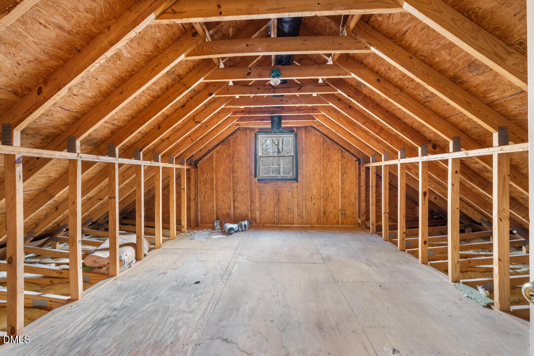 5523 Old Noble Road Cedar Grove, NC 27231 - Photo 13 of 16 an empty room with wooden floor and windows