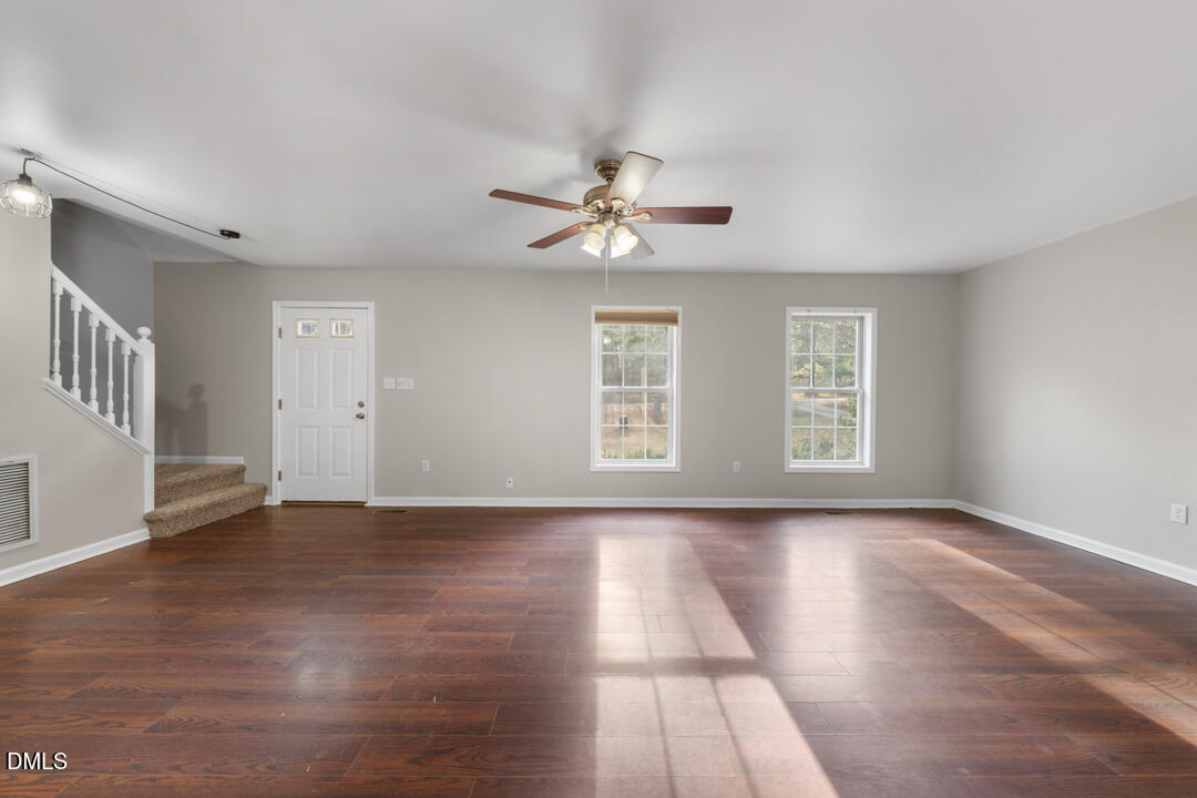 5523 Old Noble Road Cedar Grove, NC 27231 - Photo 2 of 16 a view of an empty room with a window and wooden floor