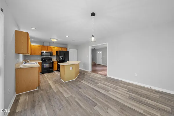a kitchen with a sink and microwave