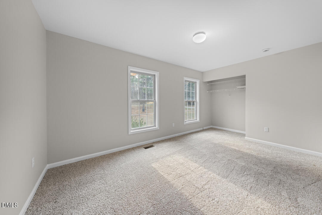 5523 Old Noble Road Cedar Grove, NC 27231 - Photo 9 of 16 an empty room with windows