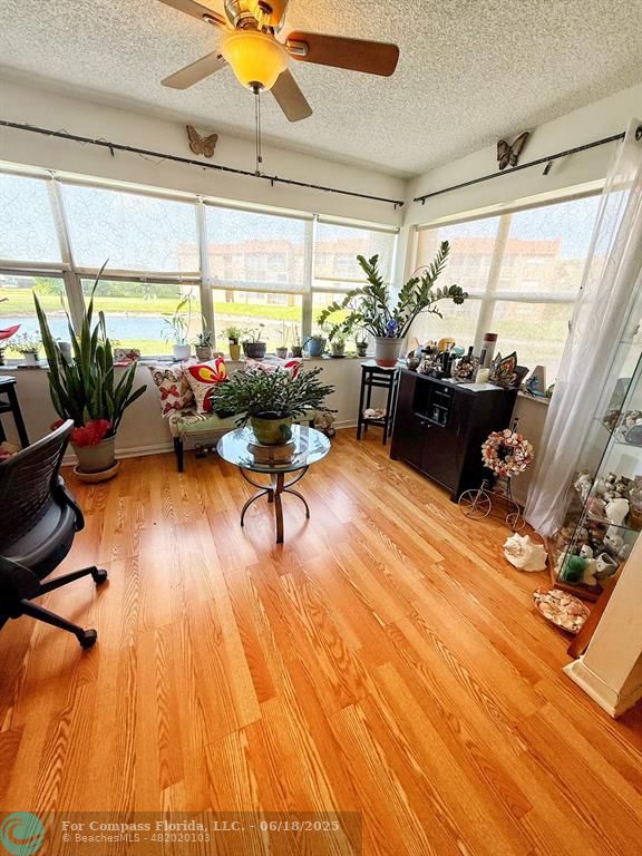 9881 Sunrise Lakes Boulevard, Unit 106 Sunrise, FL 33322 - Photo 12 of 22 a living room with furniture and a large window
