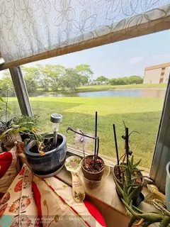 a view of a balcony with chair and umbrella