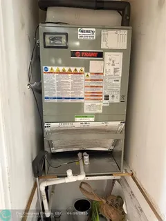 a view of water heater on wooden floor