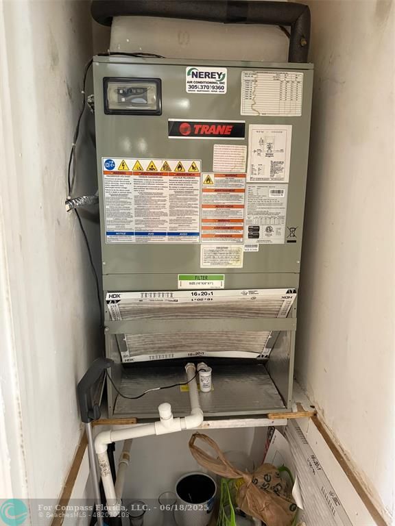 9881 Sunrise Lakes Boulevard, Unit 106 Sunrise, FL 33322 - Photo 18 of 22 a view of water heater on wooden floor