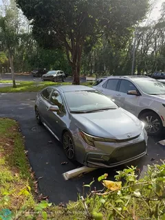 a couple of cars parked in a yard