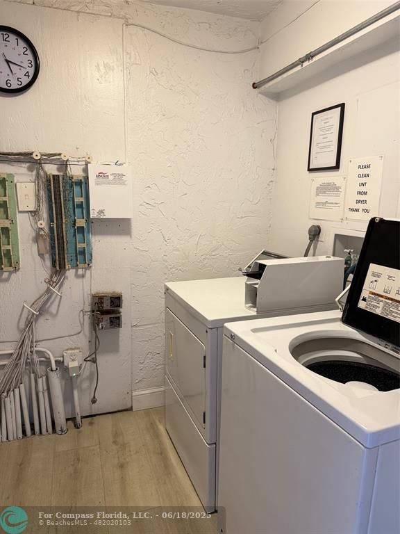 9881 Sunrise Lakes Boulevard, Unit 106 Sunrise, FL 33322 - Photo 20 of 22 a utility room with dryer and washer