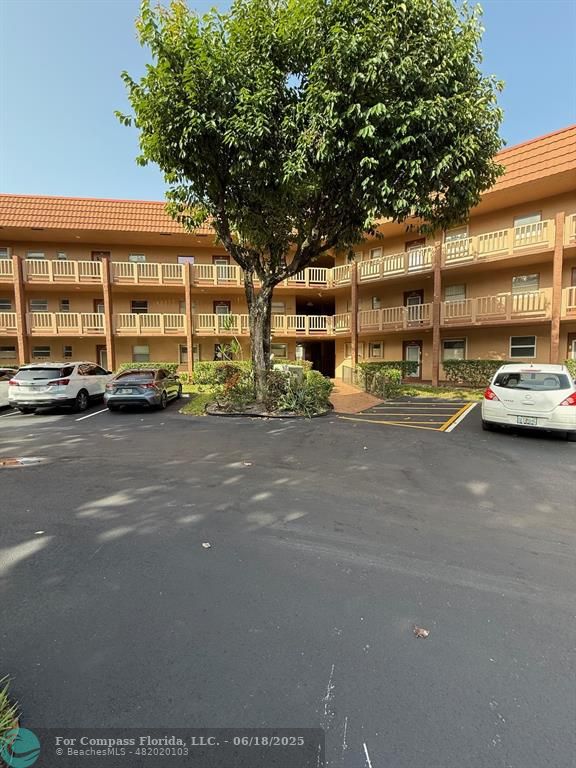 9881 Sunrise Lakes Boulevard, Unit 106 Sunrise, FL 33322 - Photo 21 of 22 a view of street with parked cars