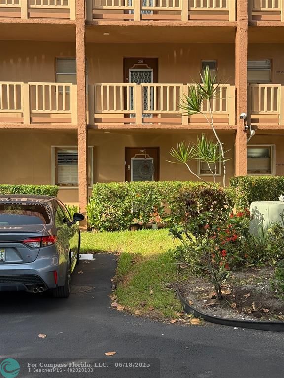 9881 Sunrise Lakes Boulevard, Unit 106 Sunrise, FL 33322 - Photo 22 of 22 a view of a car park in front of house