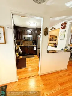 a view of a living room with furniture and a flat screen tv