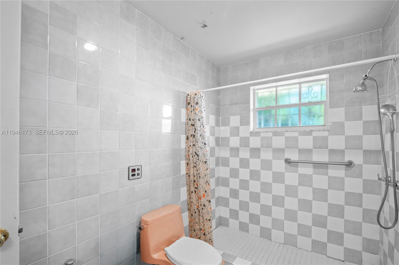 9730 Southwest 44th Street Miami, FL 33165 - Photo 17 of 53 a bathroom with a toilet sink and shower