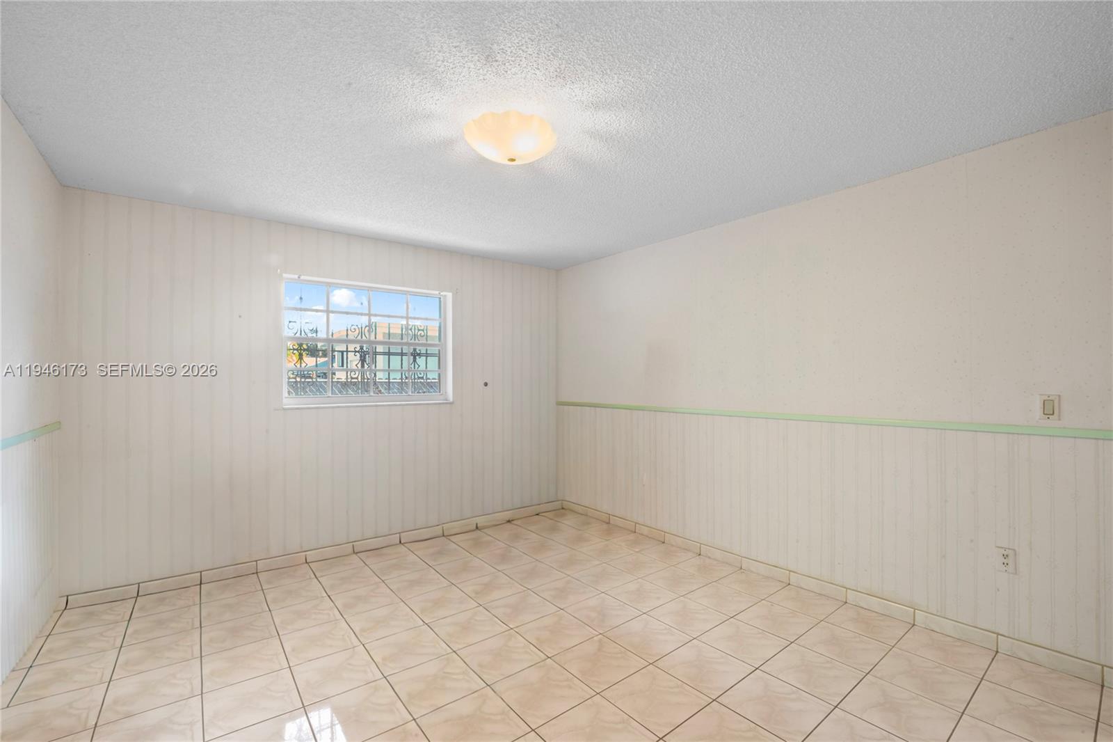 9730 Southwest 44th Street Miami, FL 33165 - Photo 21 of 53 an empty room with windows