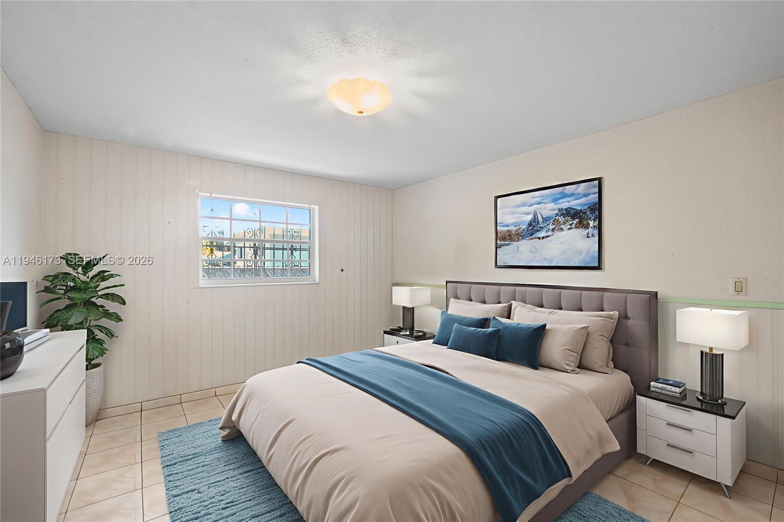 9730 Southwest 44th Street Miami, FL 33165 - Photo 22 of 53 a bedroom with bed and a potted plant