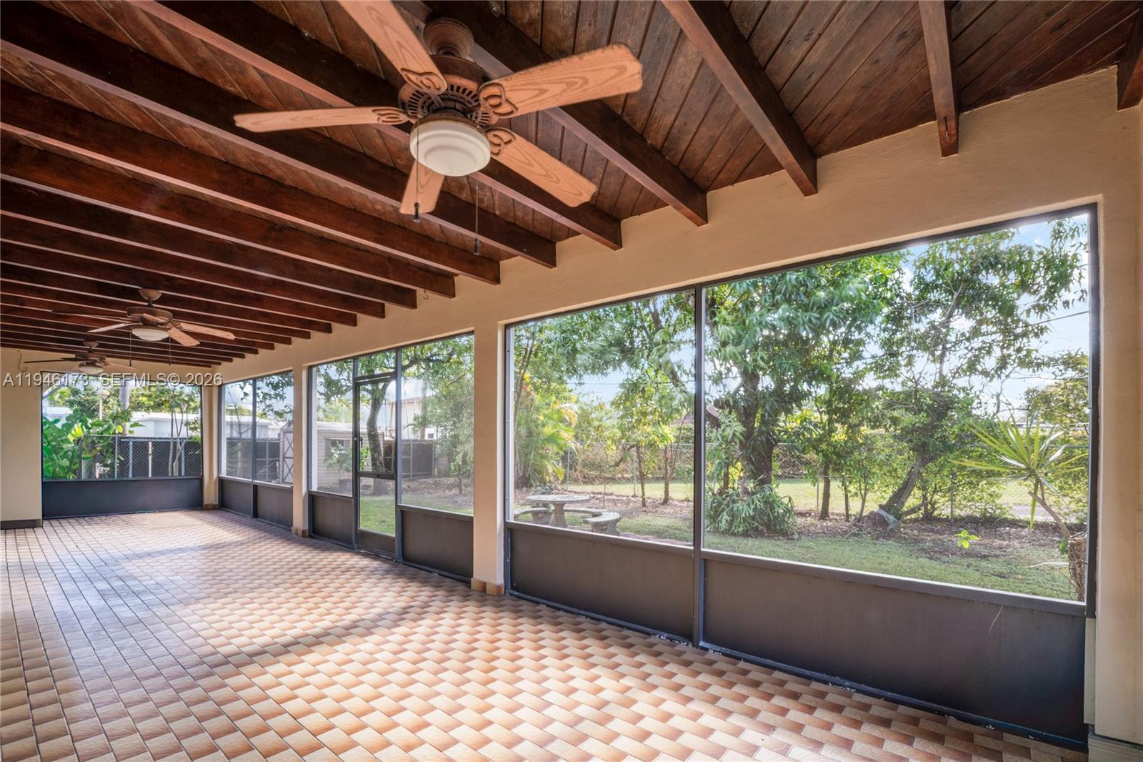 9730 Southwest 44th Street Miami, FL 33165 - Photo 37 of 53 a view of empty room with wooden floor and fan
