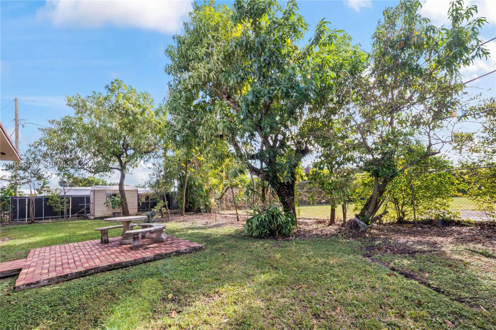 9730 Southwest 44th Street Miami, FL 33165 - Photo 42 of 53 a view of a yard with tree s