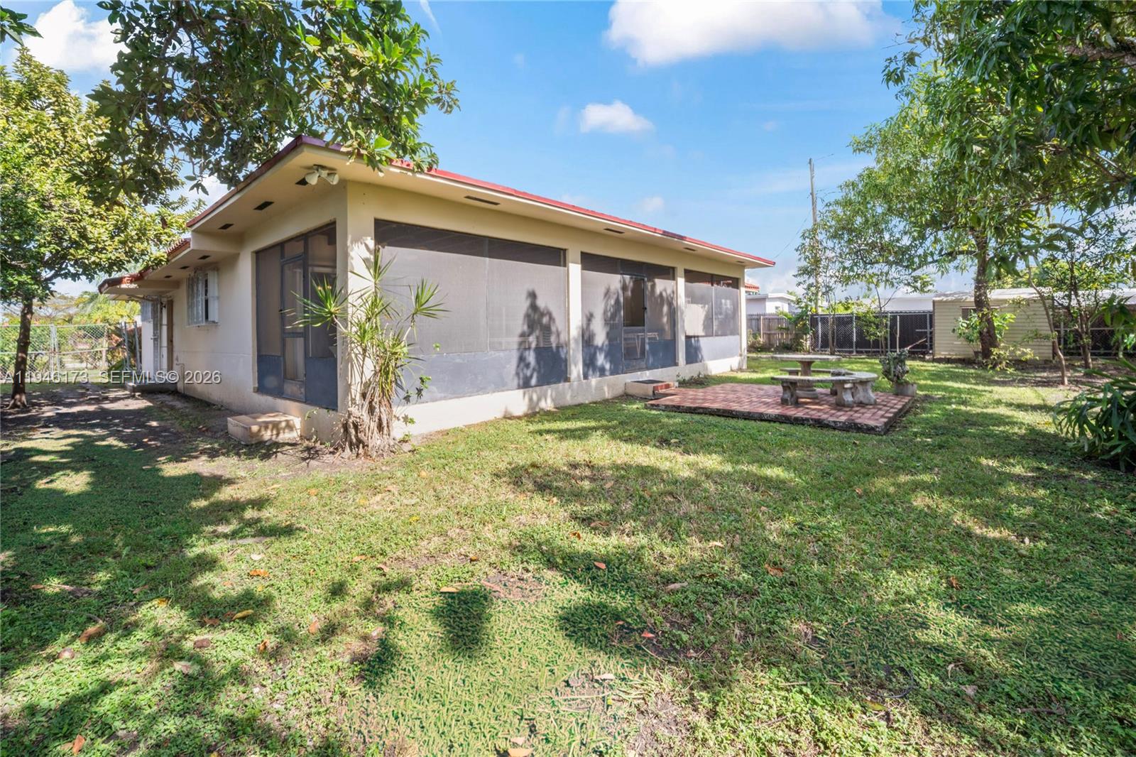 9730 Southwest 44th Street Miami, FL 33165 - Photo 45 of 53 a front view of house with yard and green space