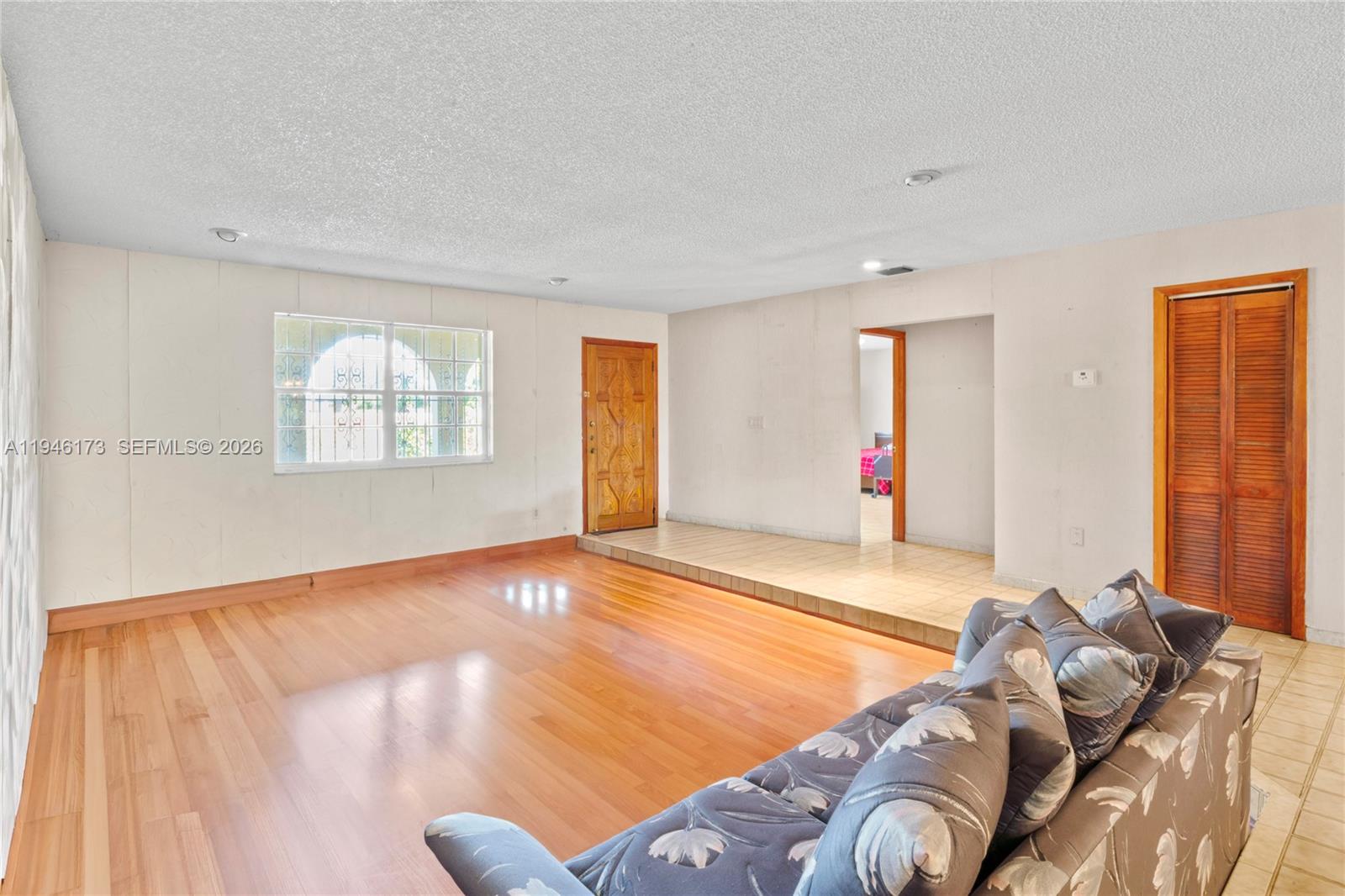 9730 Southwest 44th Street Miami, FL 33165 - Photo 8 of 53 a view of a livingroom with furniture and wooden floor