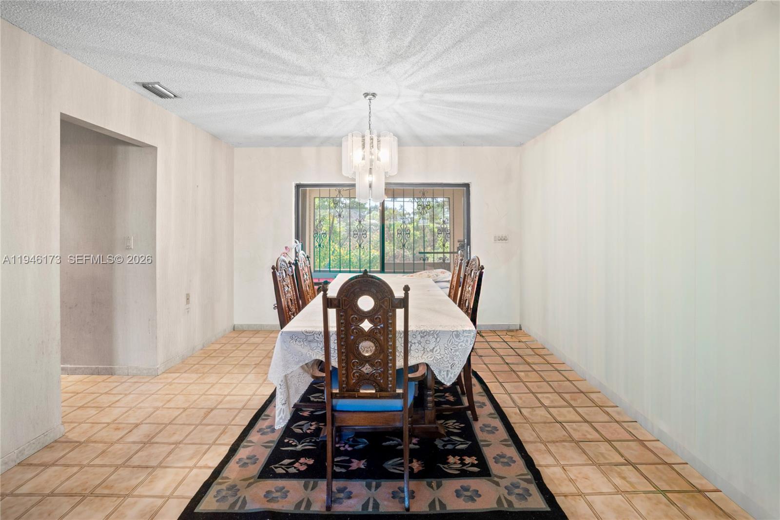 9730 Southwest 44th Street Miami, FL 33165 - Photo 10 of 53 a table and chairs in a room