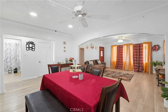 a view of a dining room with furniture and window