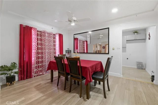 a view of a dining room with furniture and chandelier