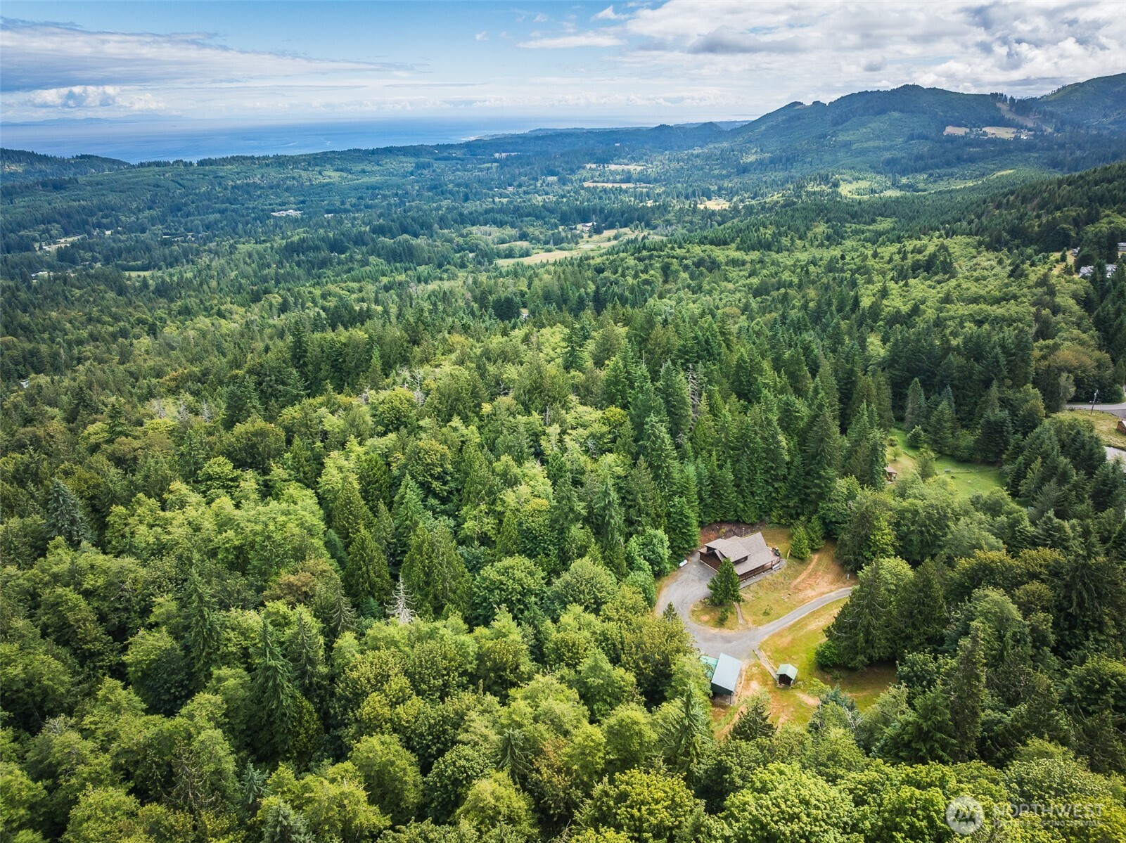 1422 Grauel-Ramapo Road Port Angeles, WA 98363 - Photo 38 of 40 an aerial view of a house with yard and outdoor seating