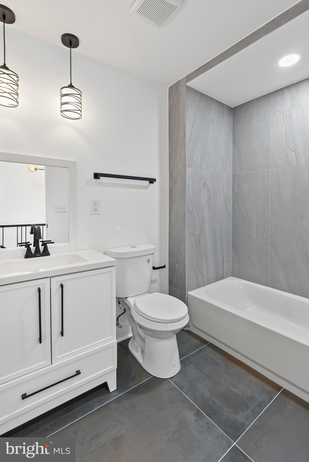 2430 East Biddle Street Baltimore, MD 21213 - Photo 11 of 26 a bathroom with a sink a toilet and shower