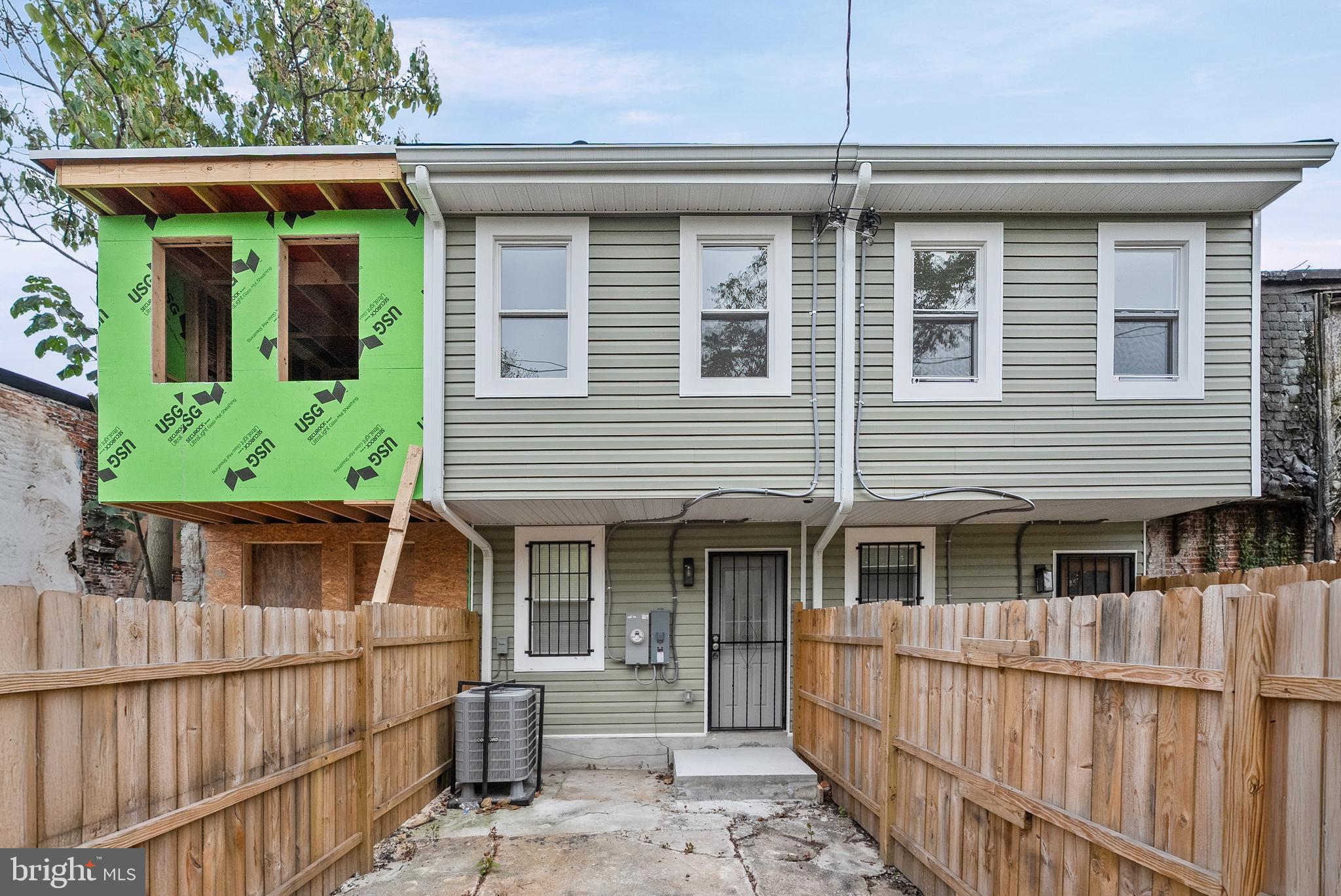 2430 East Biddle Street Baltimore, MD 21213 - Photo 18 of 26 front view of a house with a large window