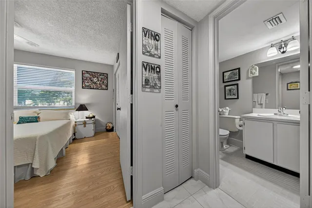 a bathroom with a sink toilet tub and shower