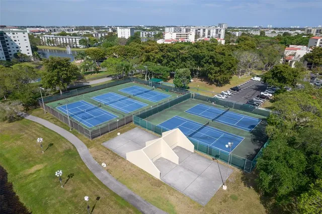 a view of a patio with swimming pool table and chairs