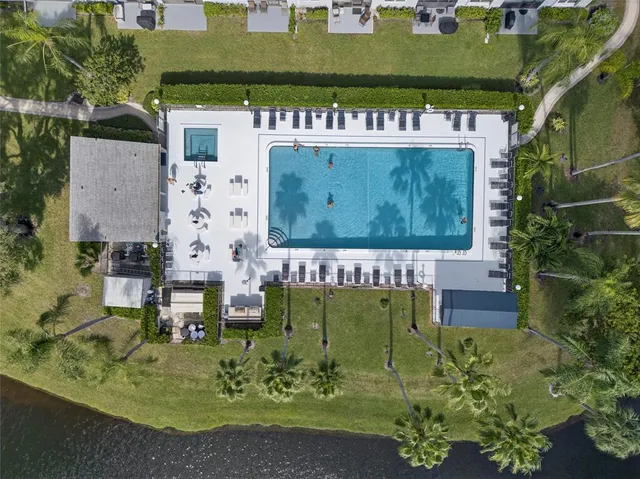 a kitchen with a sink a refrigerator and cabinets