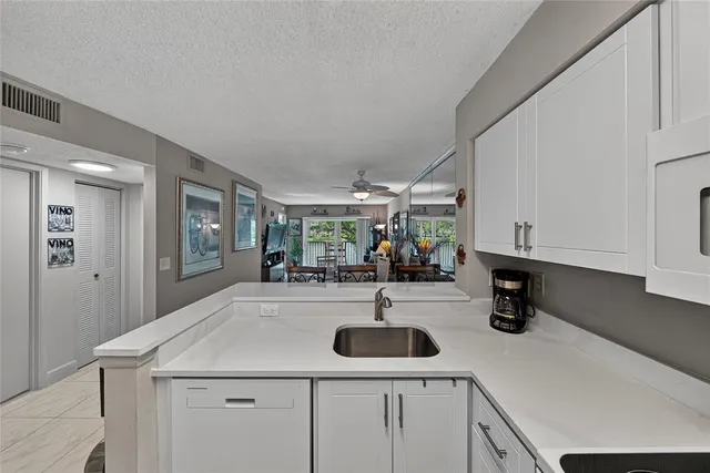 a living room with fireplace furniture and a flat screen tv