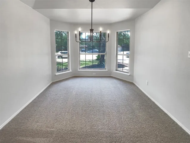 a view of a room with window outdoor space and chandelier