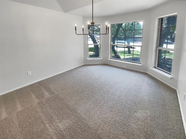 a view of a room with large windows